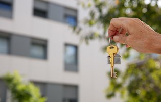 Bx_hand-holding-key-outdoors.jpg