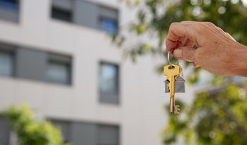 Bx_hand-holding-key-outdoors.jpg